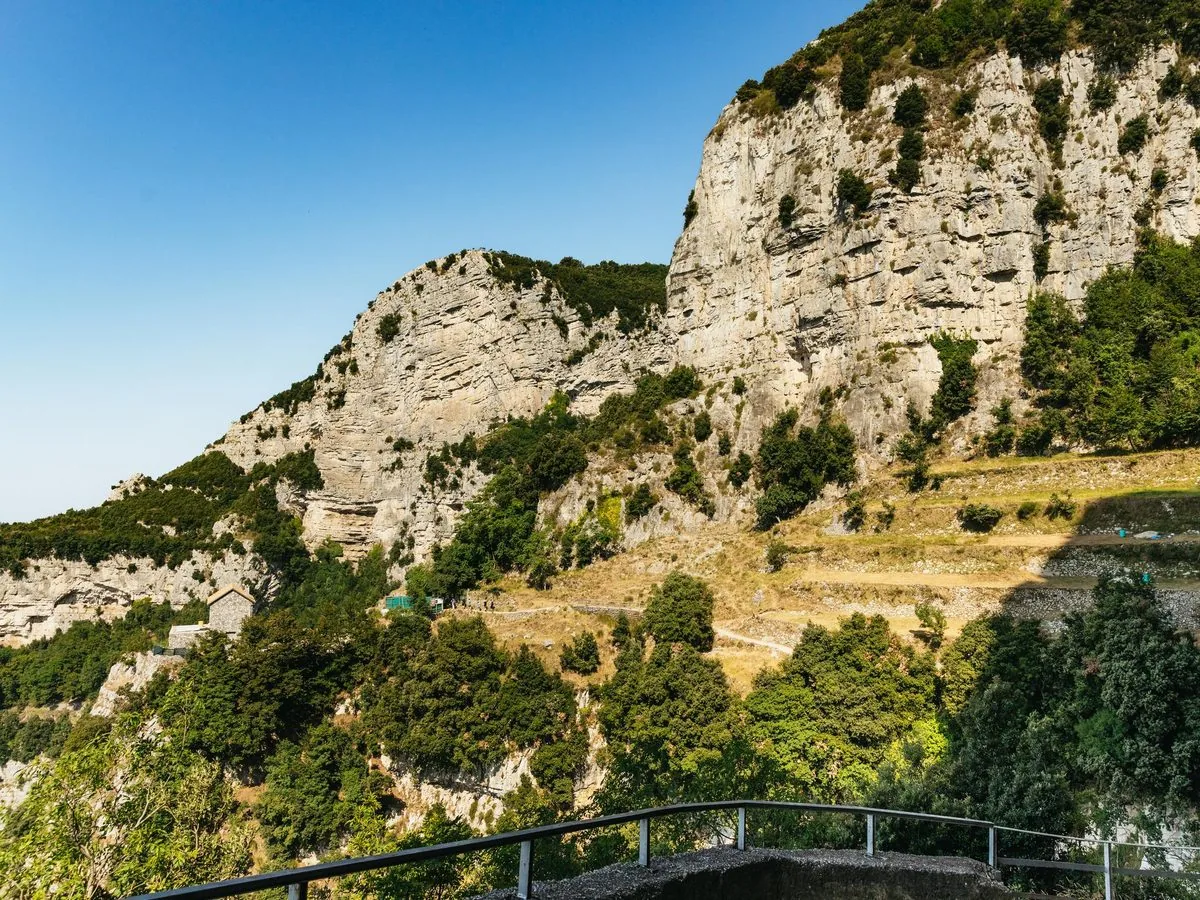 The cliff-top balcony path contours 630 m above the Tyrrhenian Sea